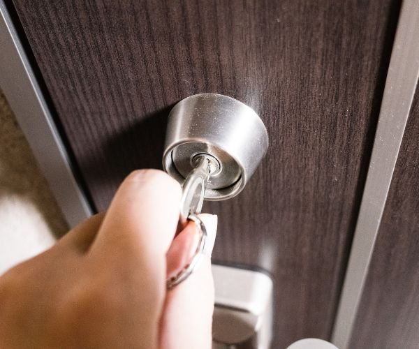Spare house key being cut on a key cutting machine